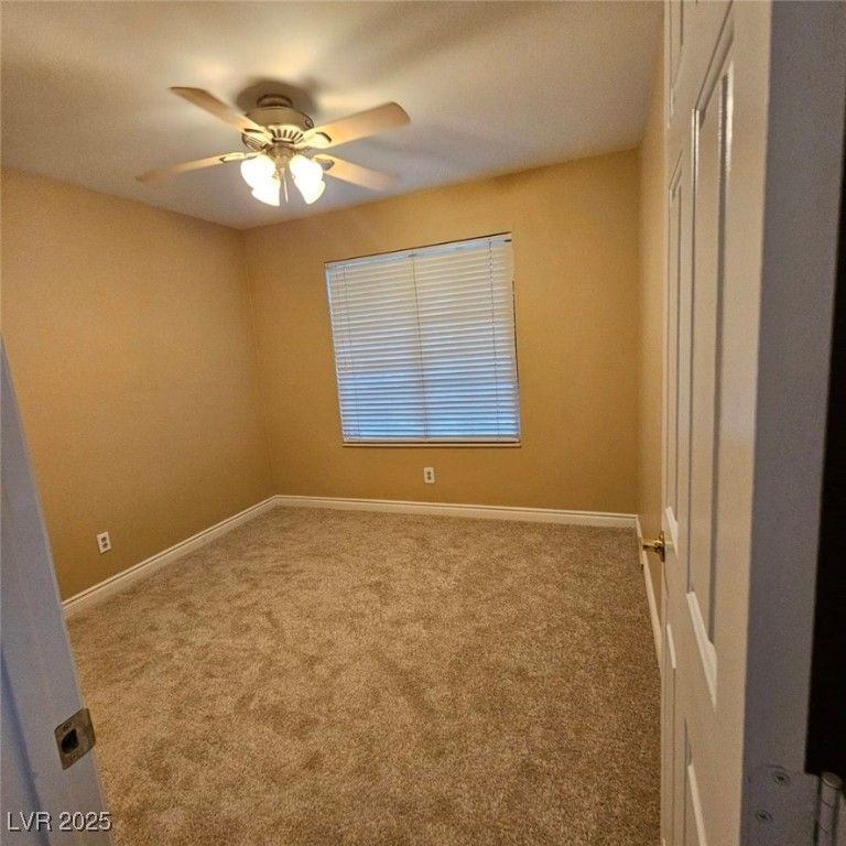 1008 Venetian Hills Lane Las Vegas, NV 89144 - Photo 15 of 18 Unfurnished room with carpet floors and a ceiling fan
