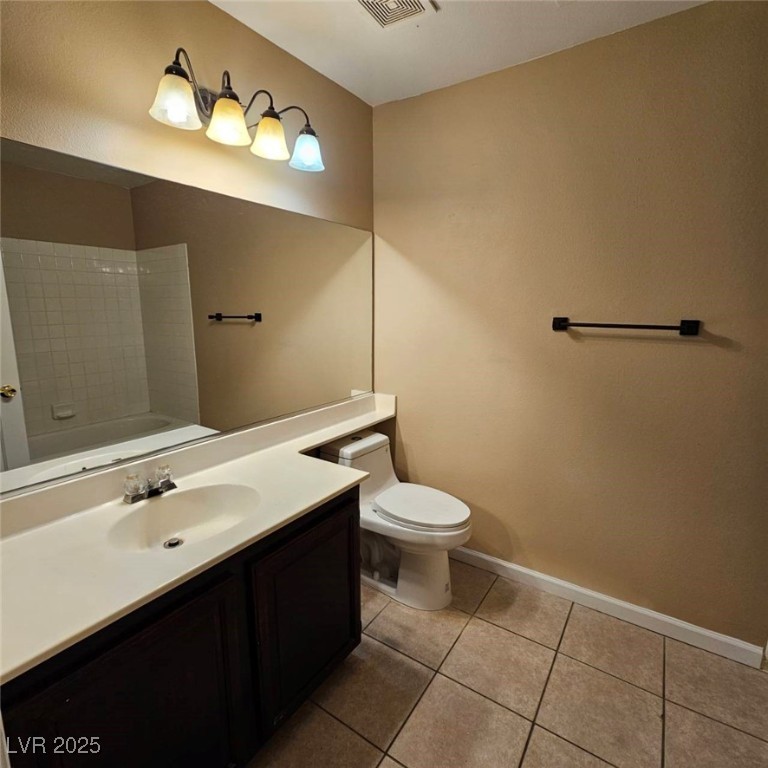 1008 Venetian Hills Lane Las Vegas, NV 89144 - Photo 16 of 18 Bathroom with vanity, light tile patterned floors, and shower / bathtub combination