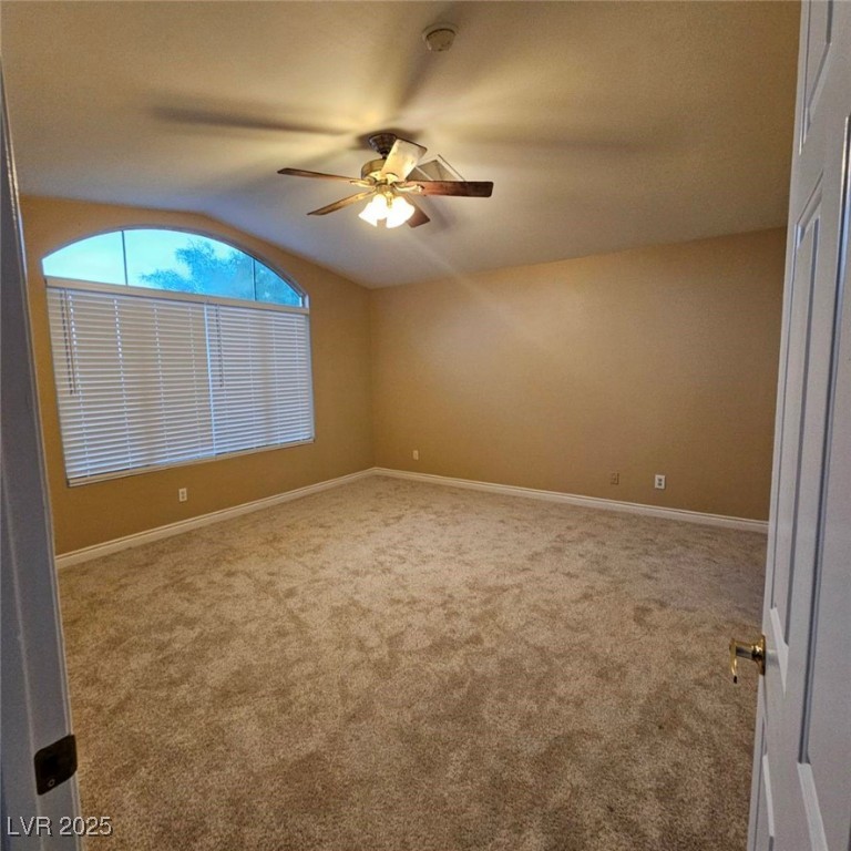 1008 Venetian Hills Lane Las Vegas, NV 89144 - Photo 10 of 18 Carpeted empty room with lofted ceiling and a ceiling fan