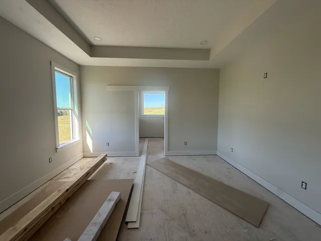 a view of an empty room with a window