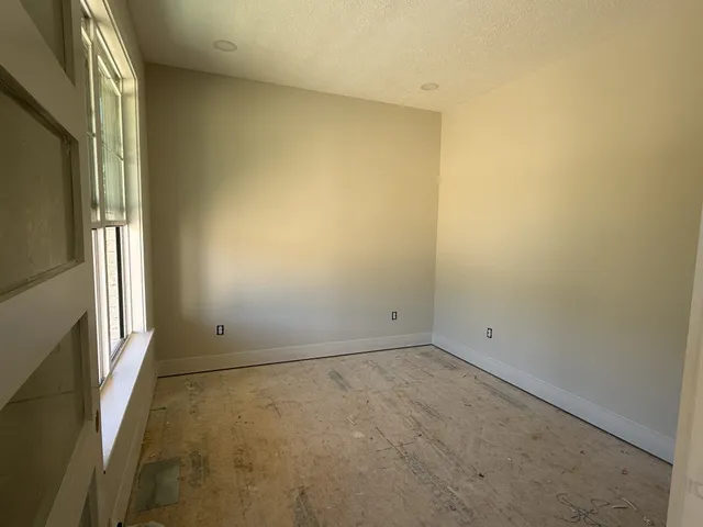 a view of empty room with a window