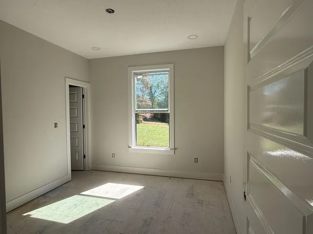 an empty room with windows