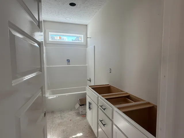 a view of a room with a big yard