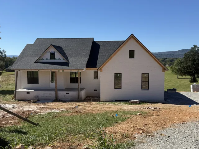 a house with trees in the background