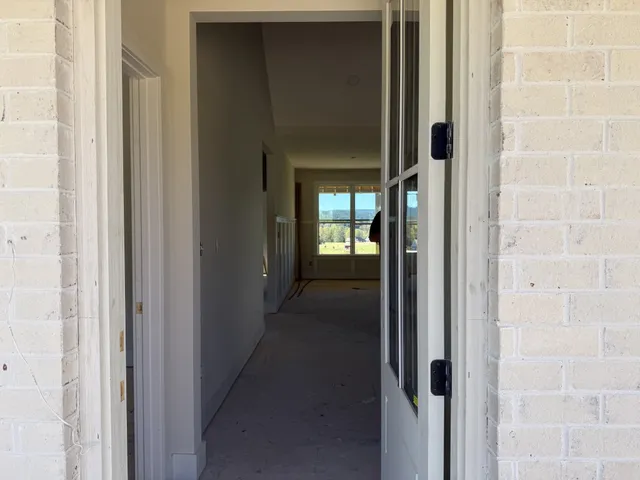 a view of a bathroom from a hallway