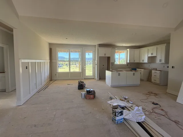 a room with a couch and windows