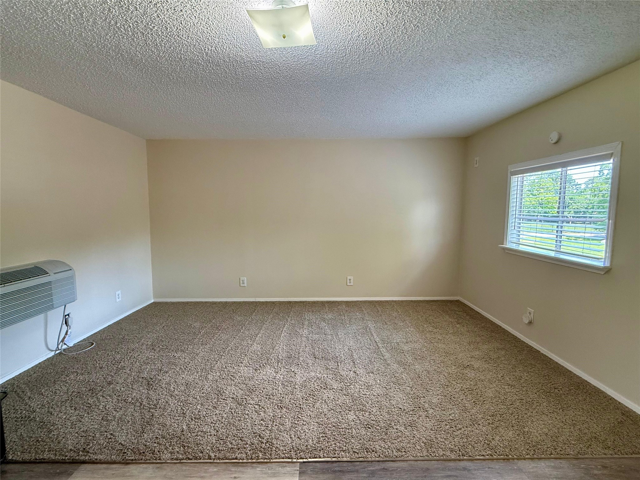 17903 Strack Drive East, Unit GARAGE Spring, TX 77379 - Photo 12 of 22 Living area with plenty of nautral light! Blinds throughout home for privacy.