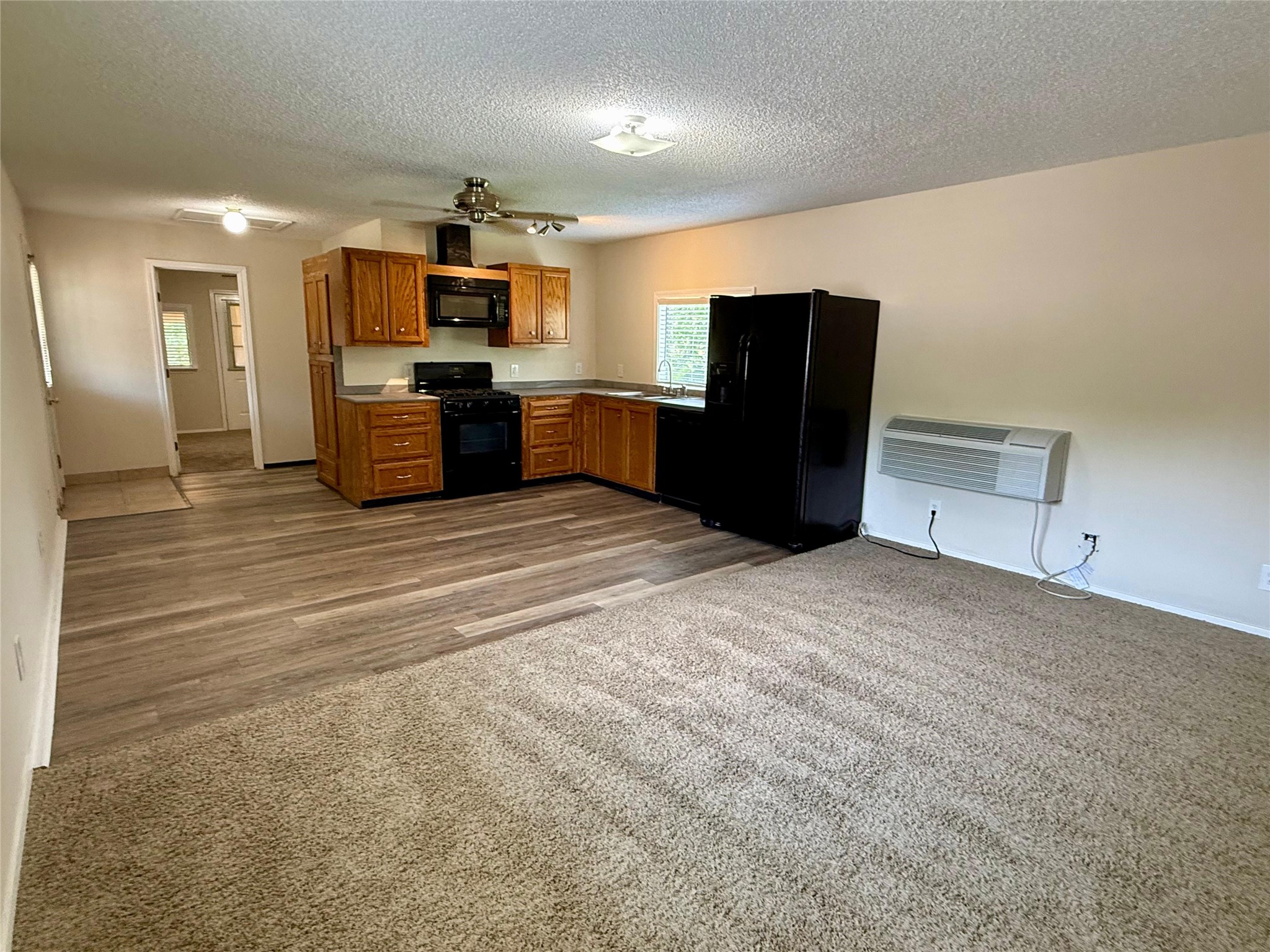 17903 Strack Drive East, Unit GARAGE Spring, TX 77379 - Photo 13 of 22 View of living area, dining, kitchen and leading to bedroom.