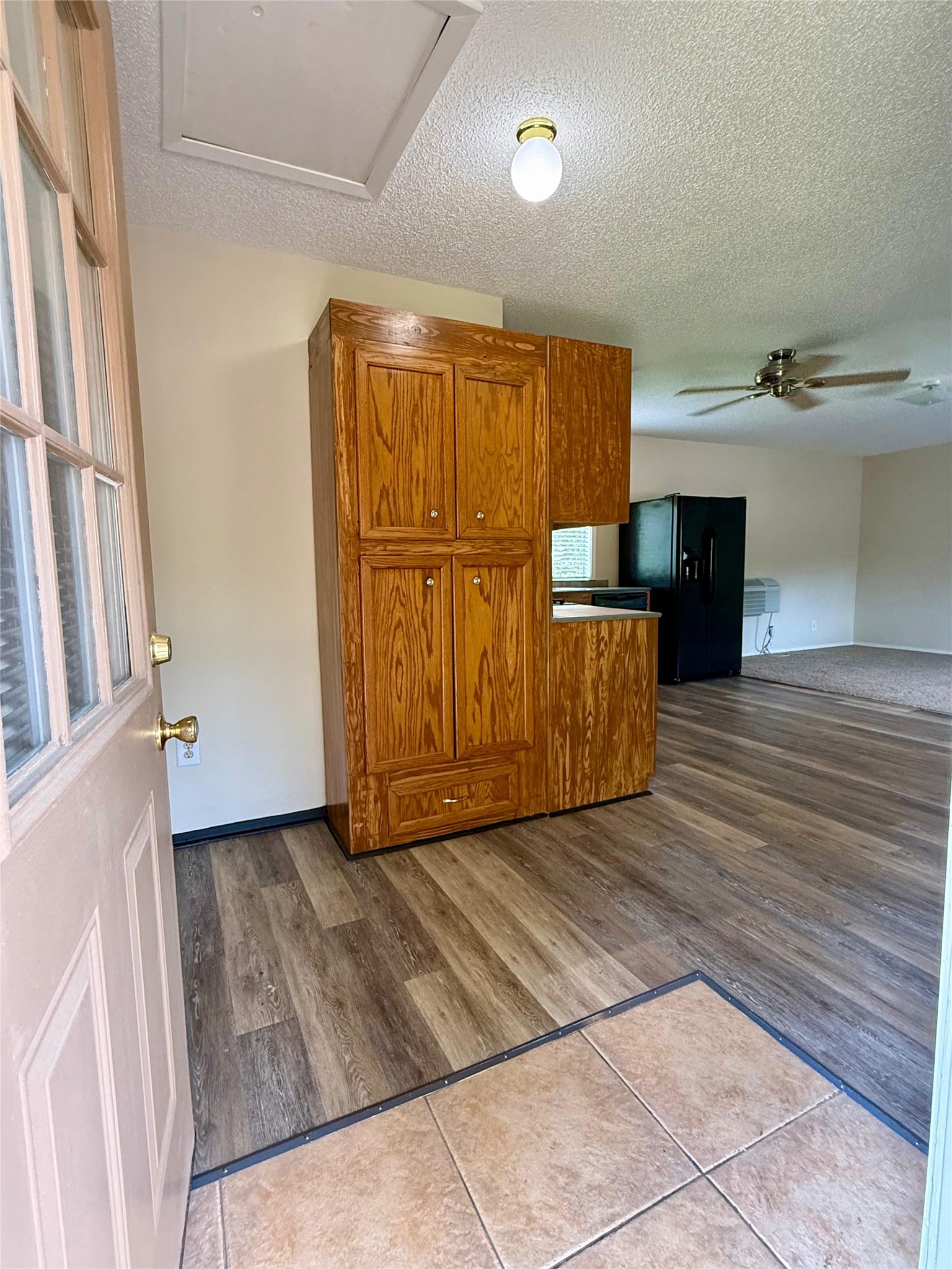 17903 Strack Drive East, Unit GARAGE Spring, TX 77379 - Photo 5 of 22 Spacious entry leading to Kitchen and Living to right. Bedroom to left of door.