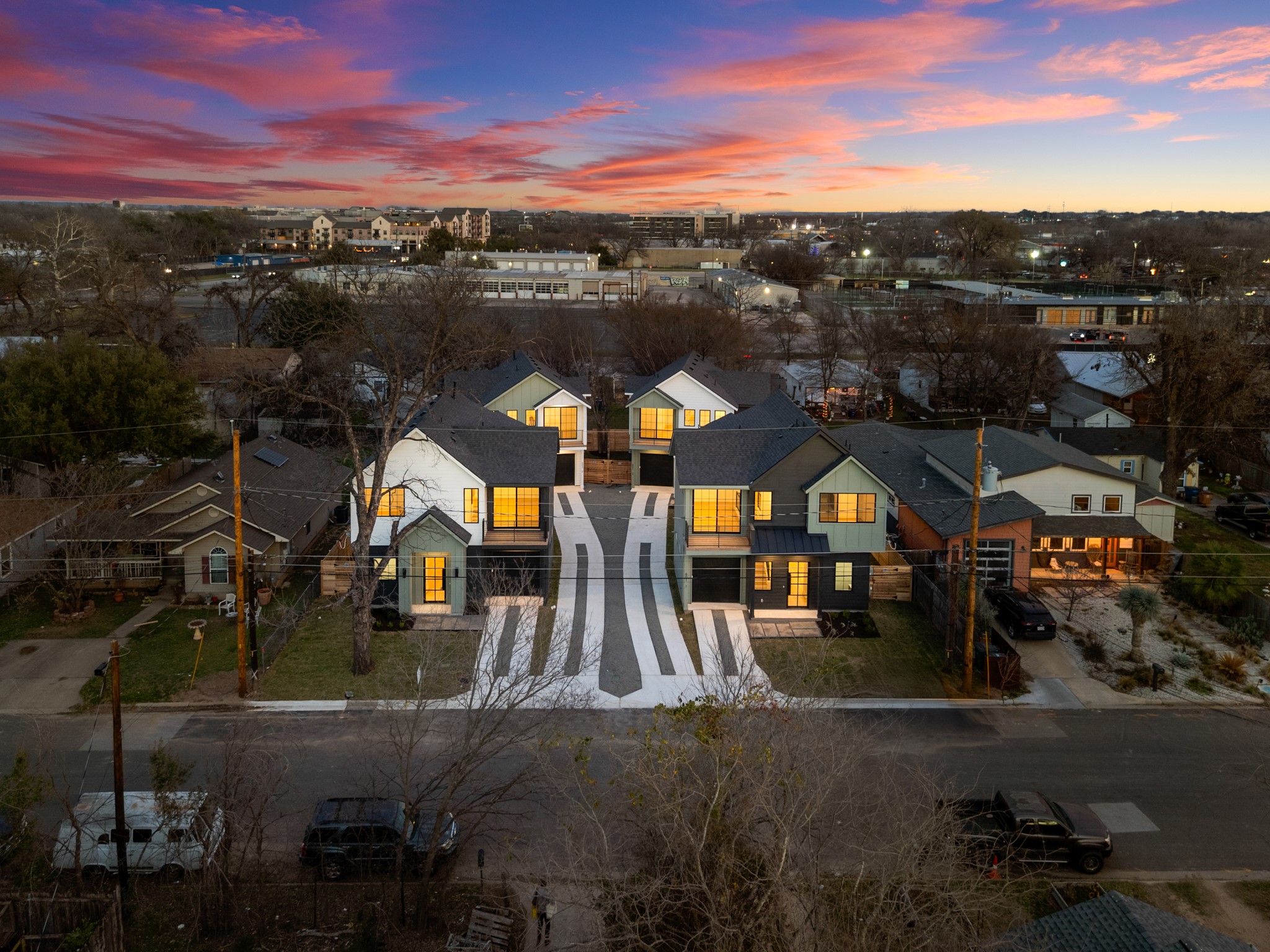 601 Vermont Road, Unit 2 Austin, TX 78702 - Photo 23 of 23 Modern architectural residences featuring varied exterior finishes, individual driveways, dark roofs, and large windows