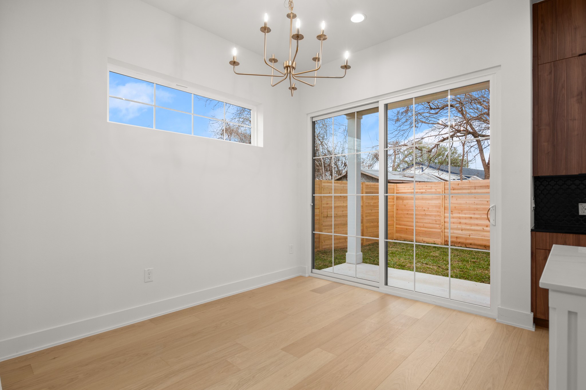 601 Vermont Road, Unit 2 Austin, TX 78702 - Photo 10 of 23 Light wood-finish flooring complements the crisp white walls