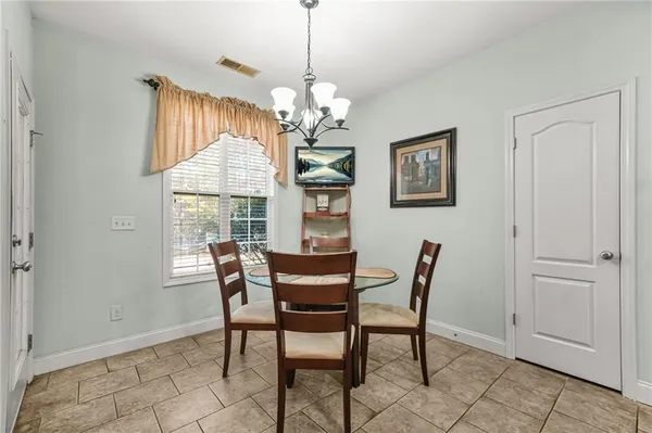 a dining room with furniture and window