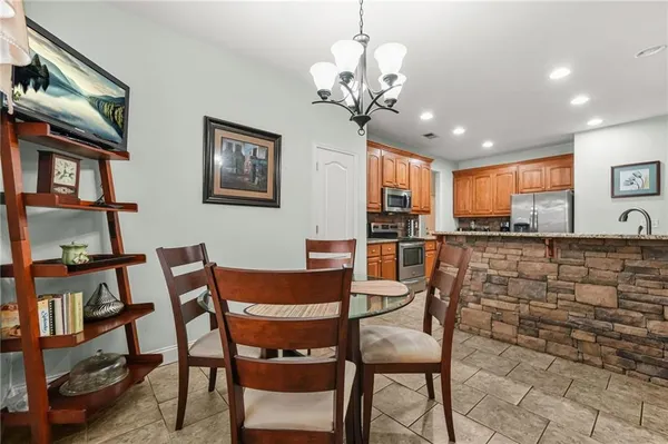 a dining room with furniture and window