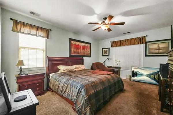 a bedroom with bed and window