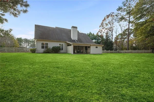 a view of a tree in front of a house