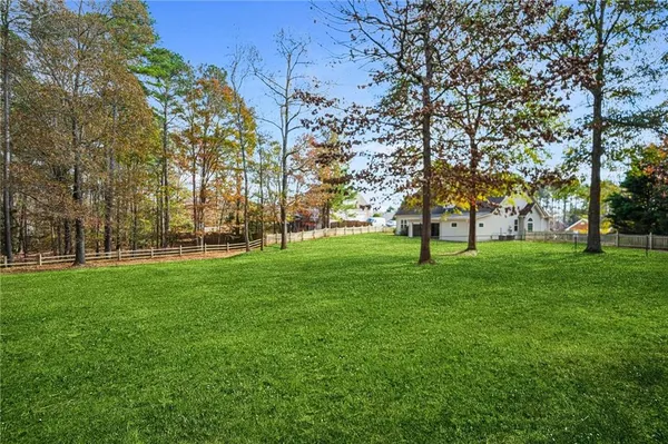 an aerial view of a house with outdoor space