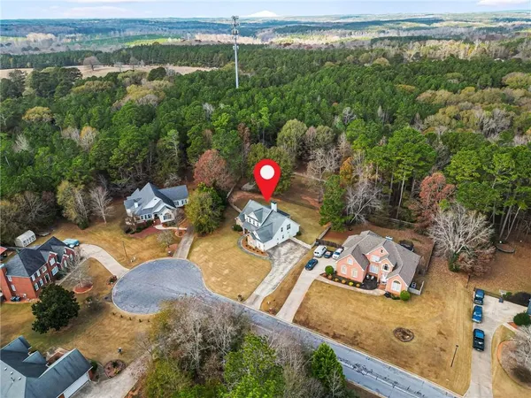 a view of a swimming pool with a yard and mountain view
