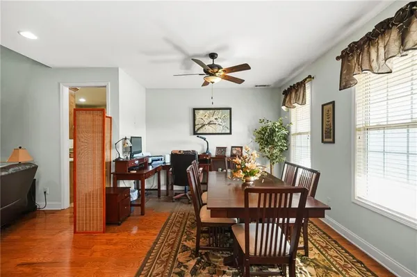 a view of a dining room with furniture window and wooden floor
