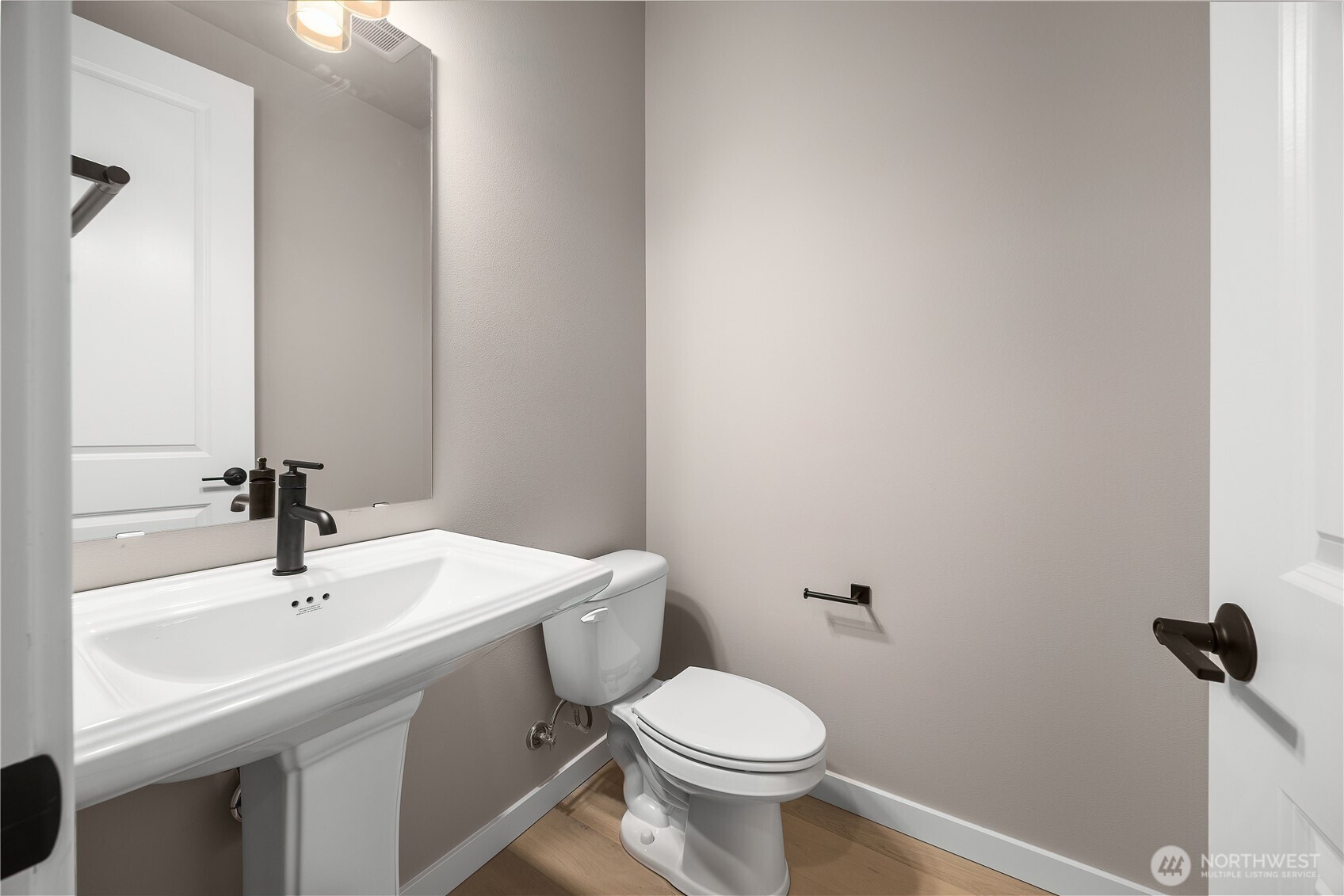 24226 Brier Road Brier, WA 98036 - Photo 18 of 35 a bathroom with a sink a toilet and mirror