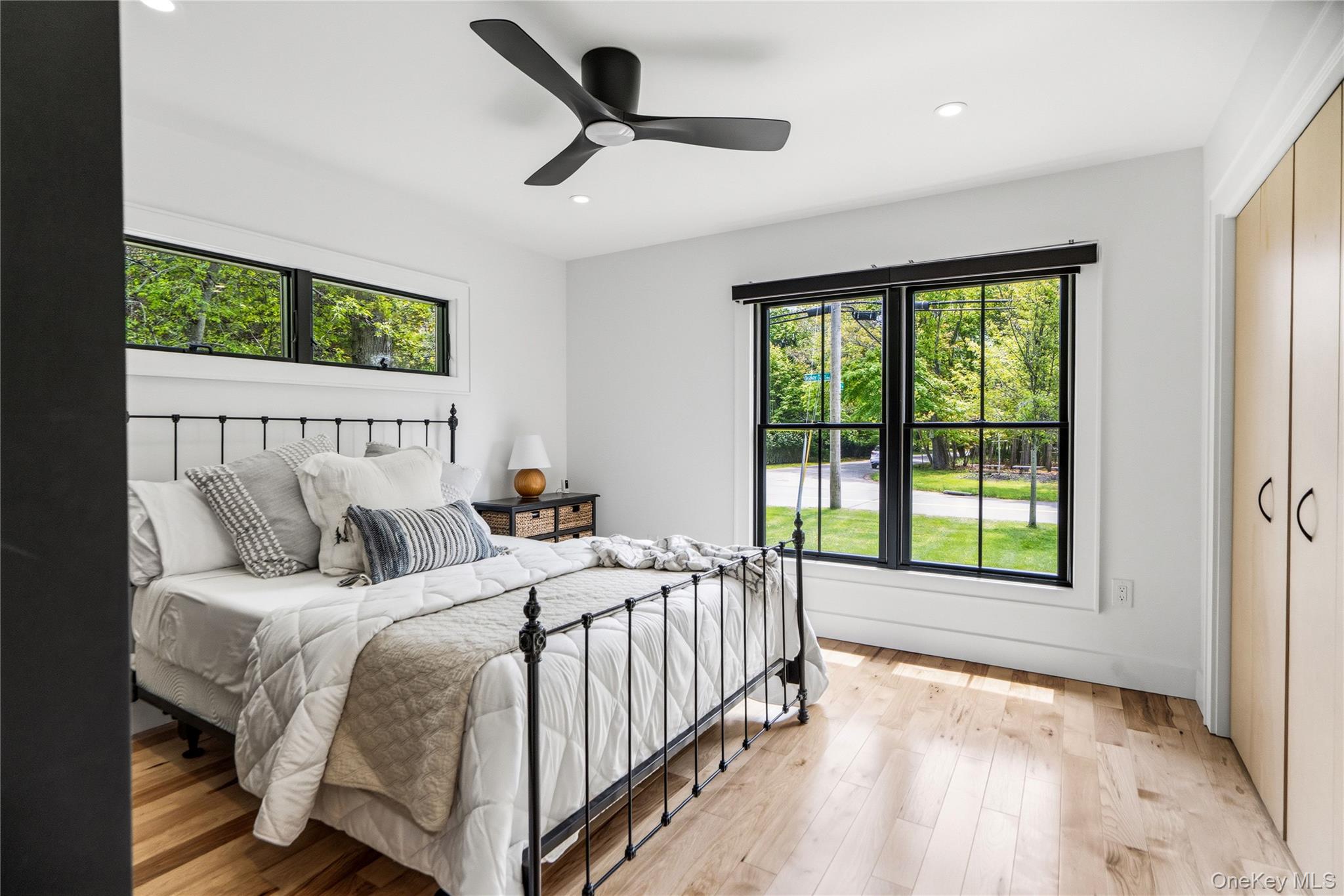 263 Beaver Dam Road Brookhaven, NY 11719 - Photo 22 of 32 a bedroom with a large bed and a large window