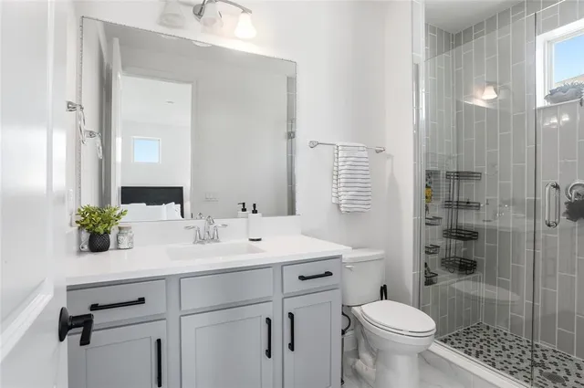 a bedroom with a large bed and a large window