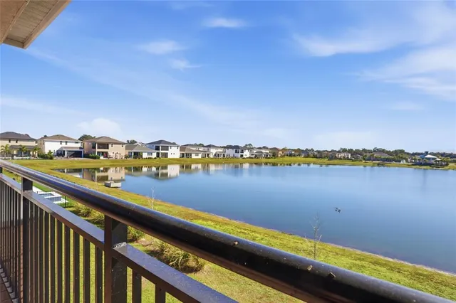 an aerial view of a house with a swimming pool yard and outdoor seating