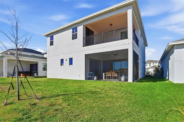 an aerial view of a house with a swimming pool