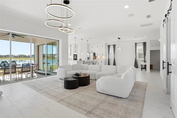 a view of a balcony with furniture and wooden floor