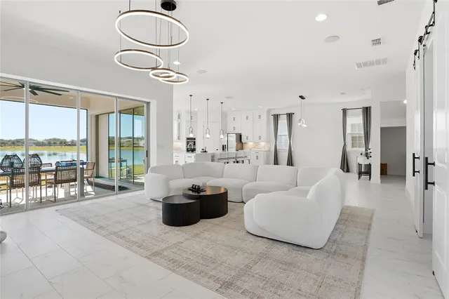 a view of a balcony with furniture and wooden floor