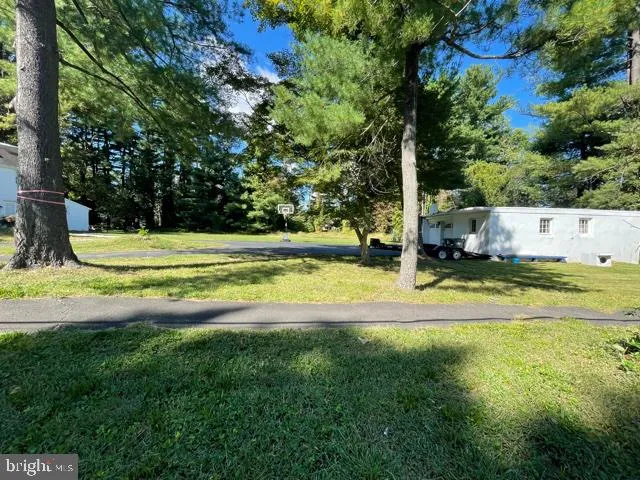 a view of a swimming pool with a yard