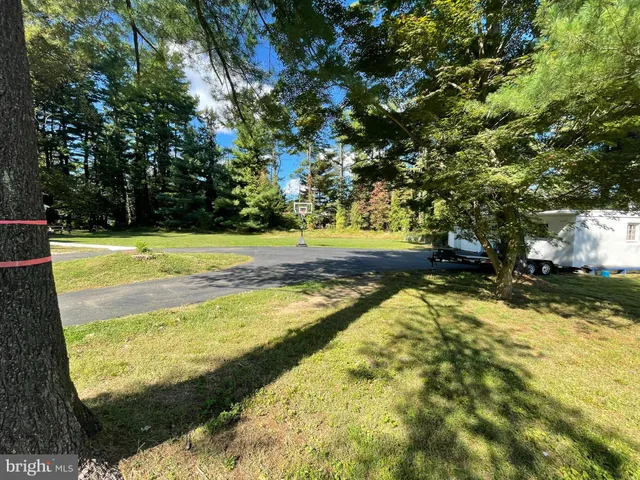 a view of a swimming pool with an outdoor space and seating area