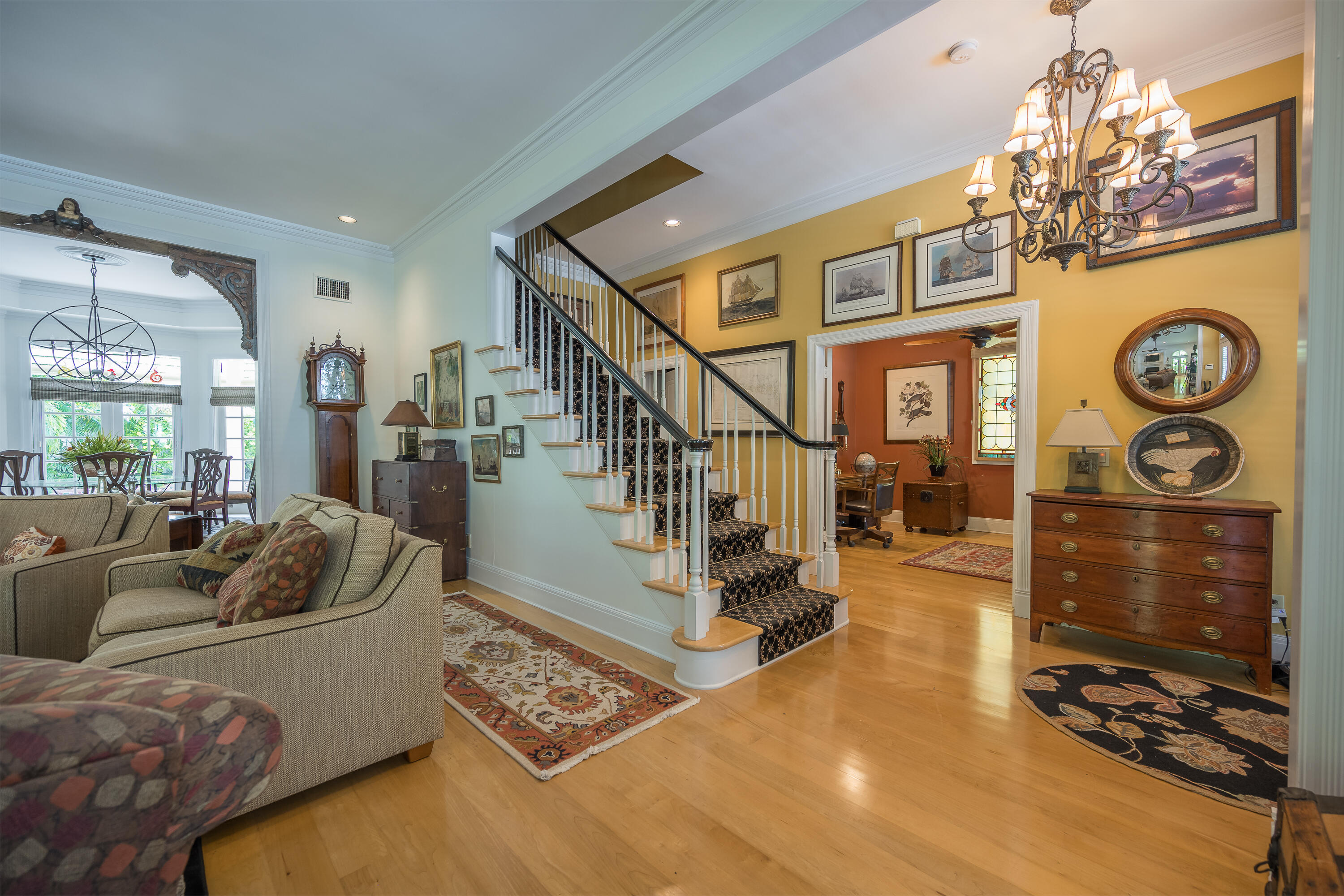 64 Front Street Key West, FL 33040 - Photo 3 of 5 a living room with furniture and a chandelier