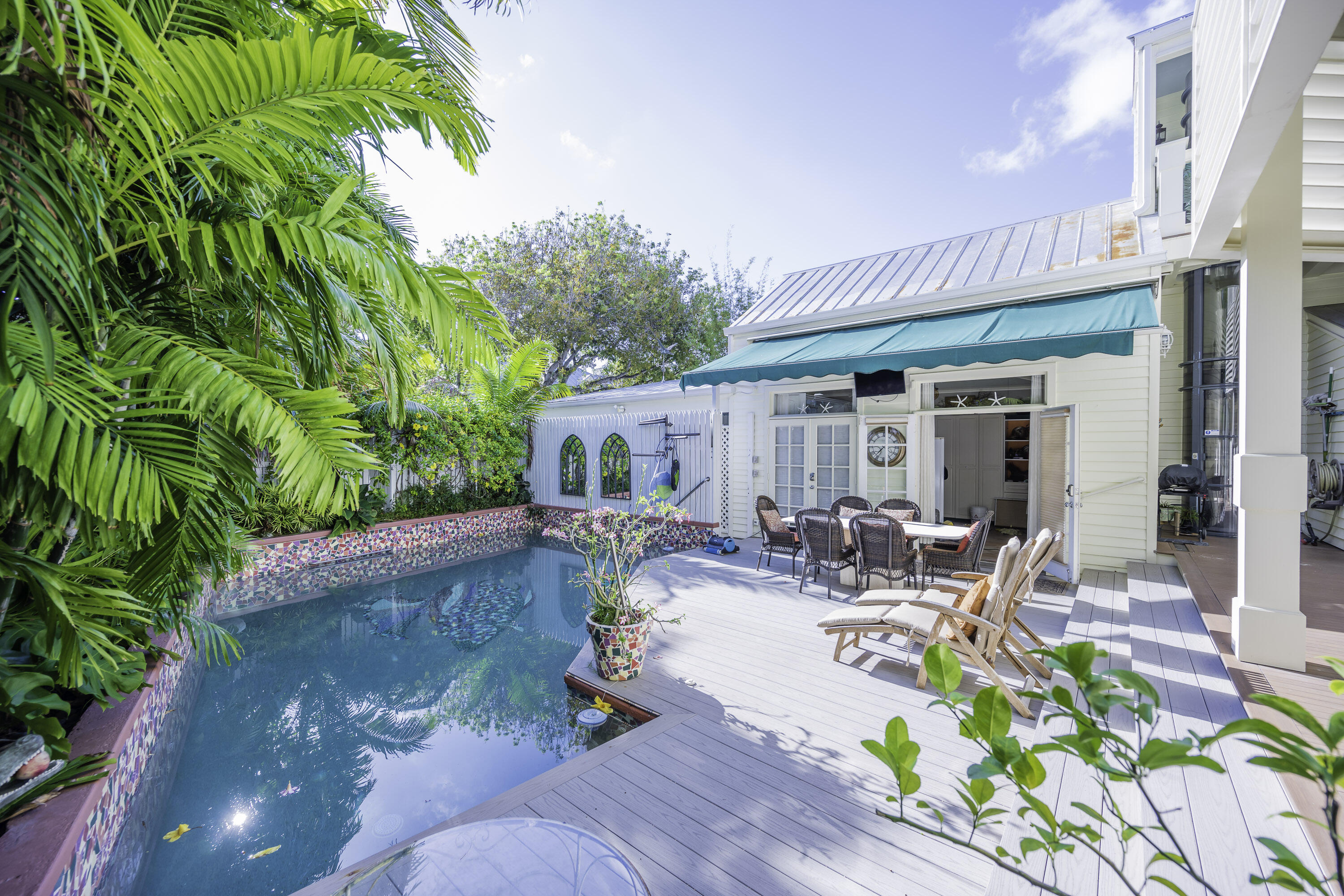 64 Front Street Key West, FL 33040 - Photo 5 of 5 a view of a swimming pool with outdoor seating