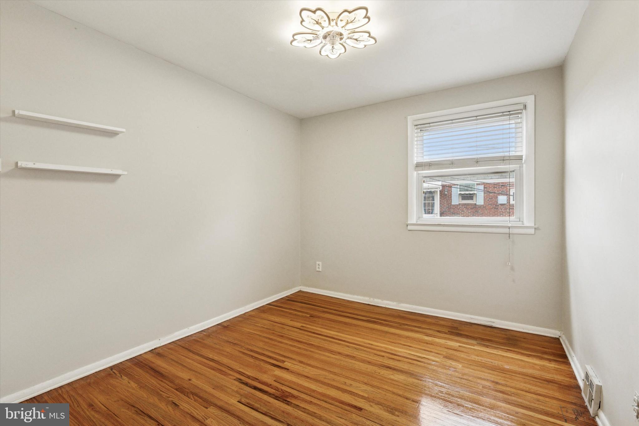 2678 Tremont Street Philadelphia, PA 19152 - Photo 17 of 24 a view of a room with wooden floor and windows