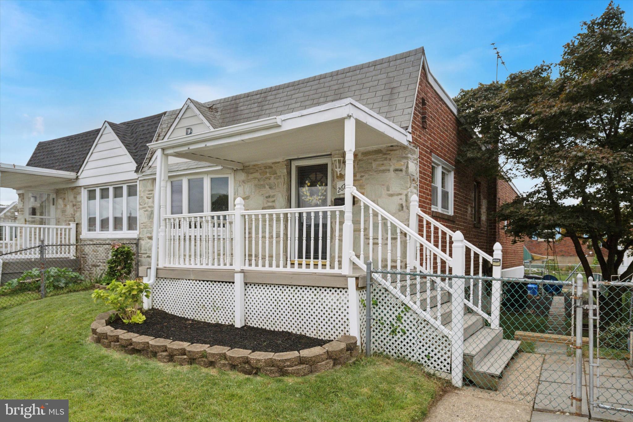 2678 Tremont Street Philadelphia, PA 19152 - Photo 2 of 24 a front view of a house with a garden