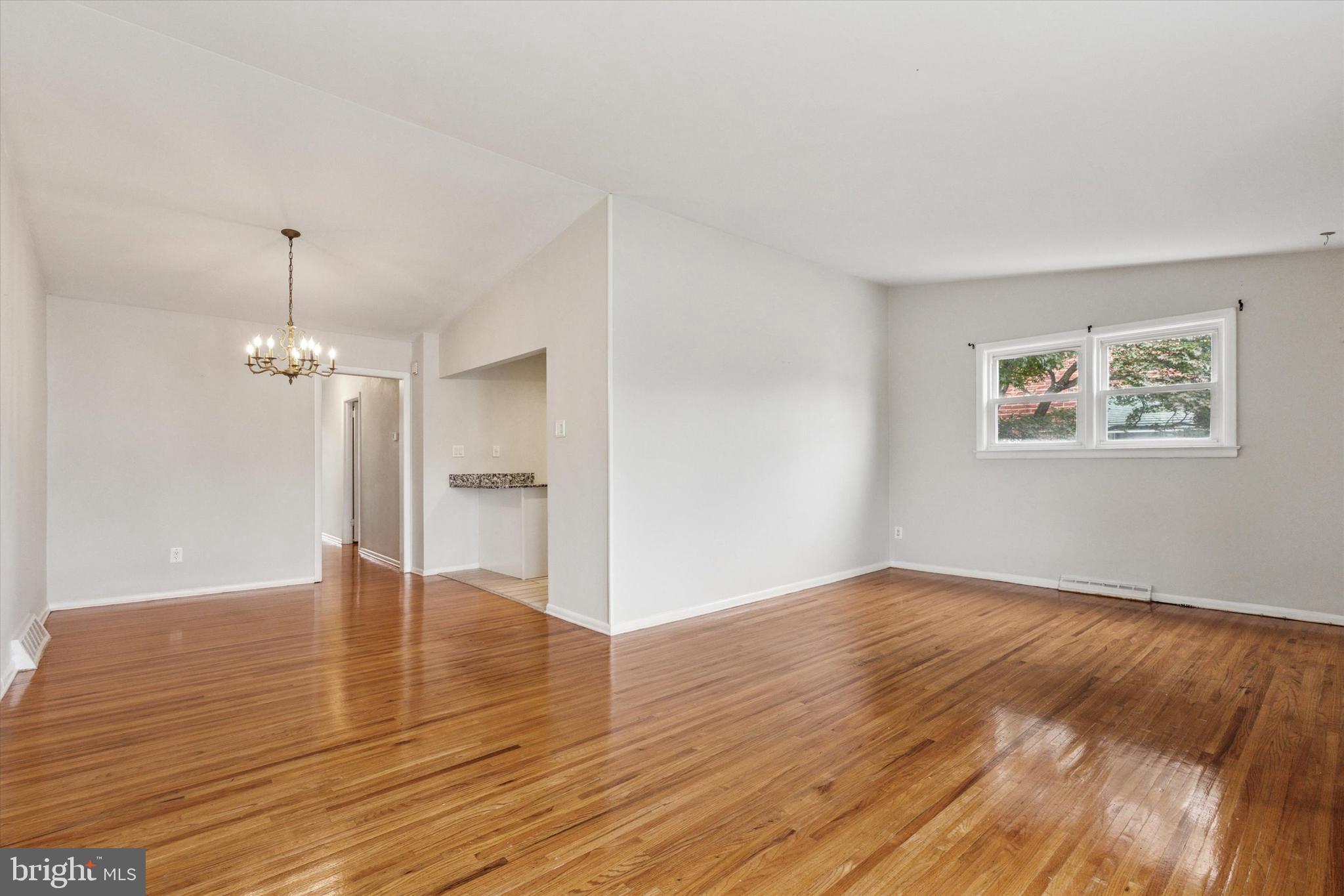 2678 Tremont Street Philadelphia, PA 19152 - Photo 8 of 24 a view of an empty room with wooden floor and a window