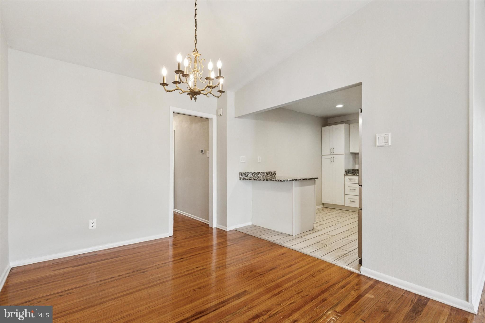 2678 Tremont Street Philadelphia, PA 19152 - Photo 9 of 24 a view of a room with wooden floor and a ceiling fan