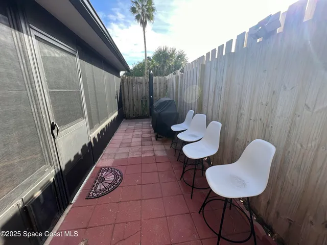 a view of a chair in wooden floor