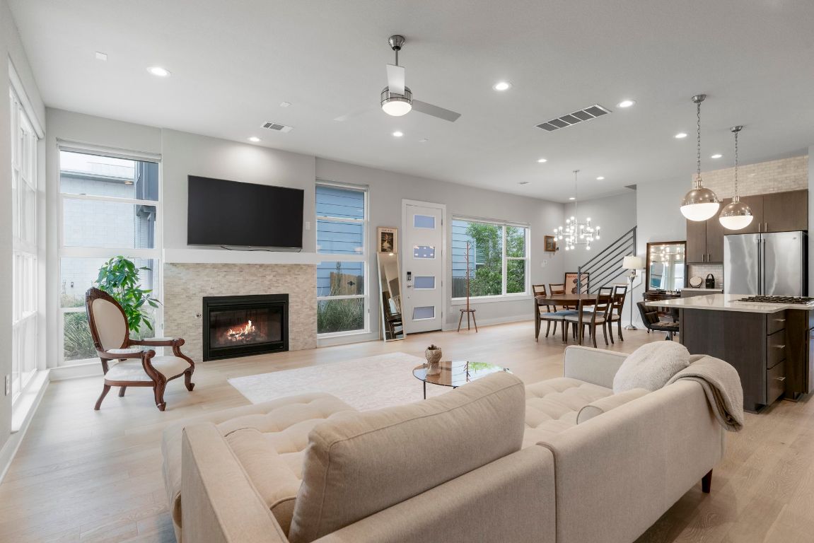 a living room with furniture and a fireplace