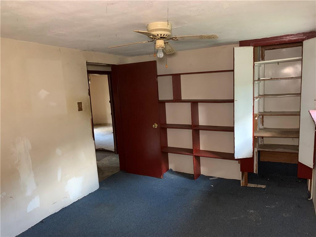 302 Arcadia Road Arcadia, PA 15712 - Photo 14 of 25 a view of walk in closet with empty racks