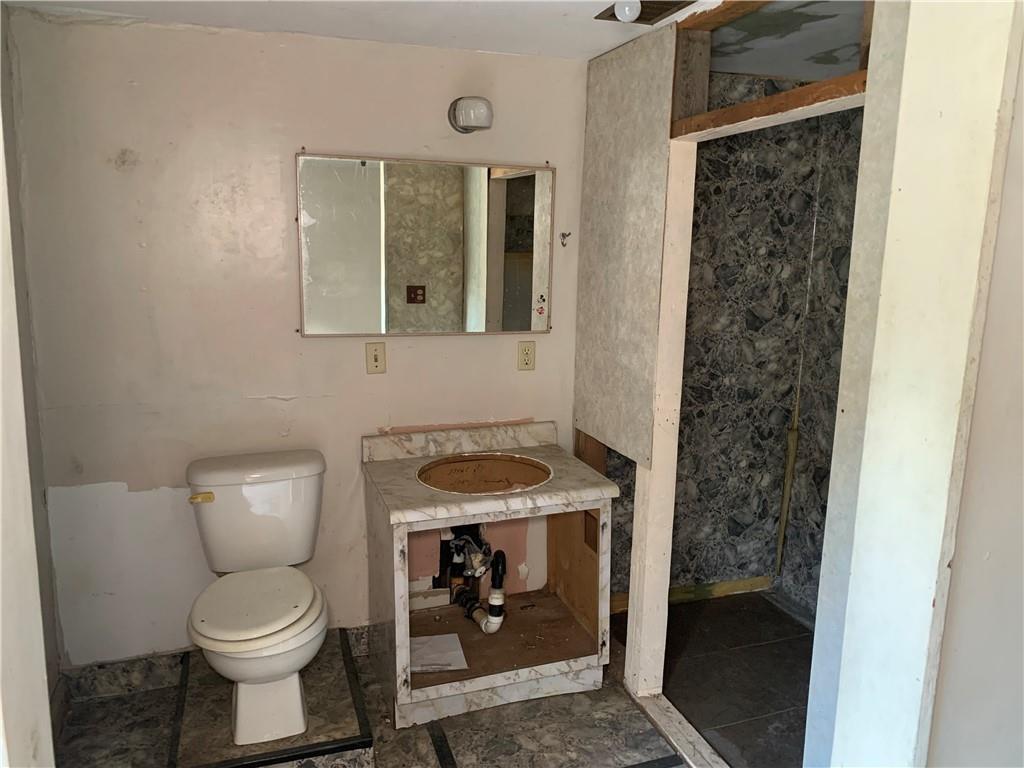 302 Arcadia Road Arcadia, PA 15712 - Photo 17 of 25 a bathroom with a toilet and a sink