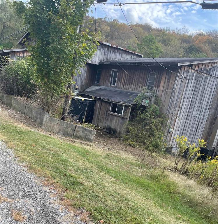 302 Arcadia Road Arcadia, PA 15712 - Photo 24 of 25 a view of a backyard with a tub