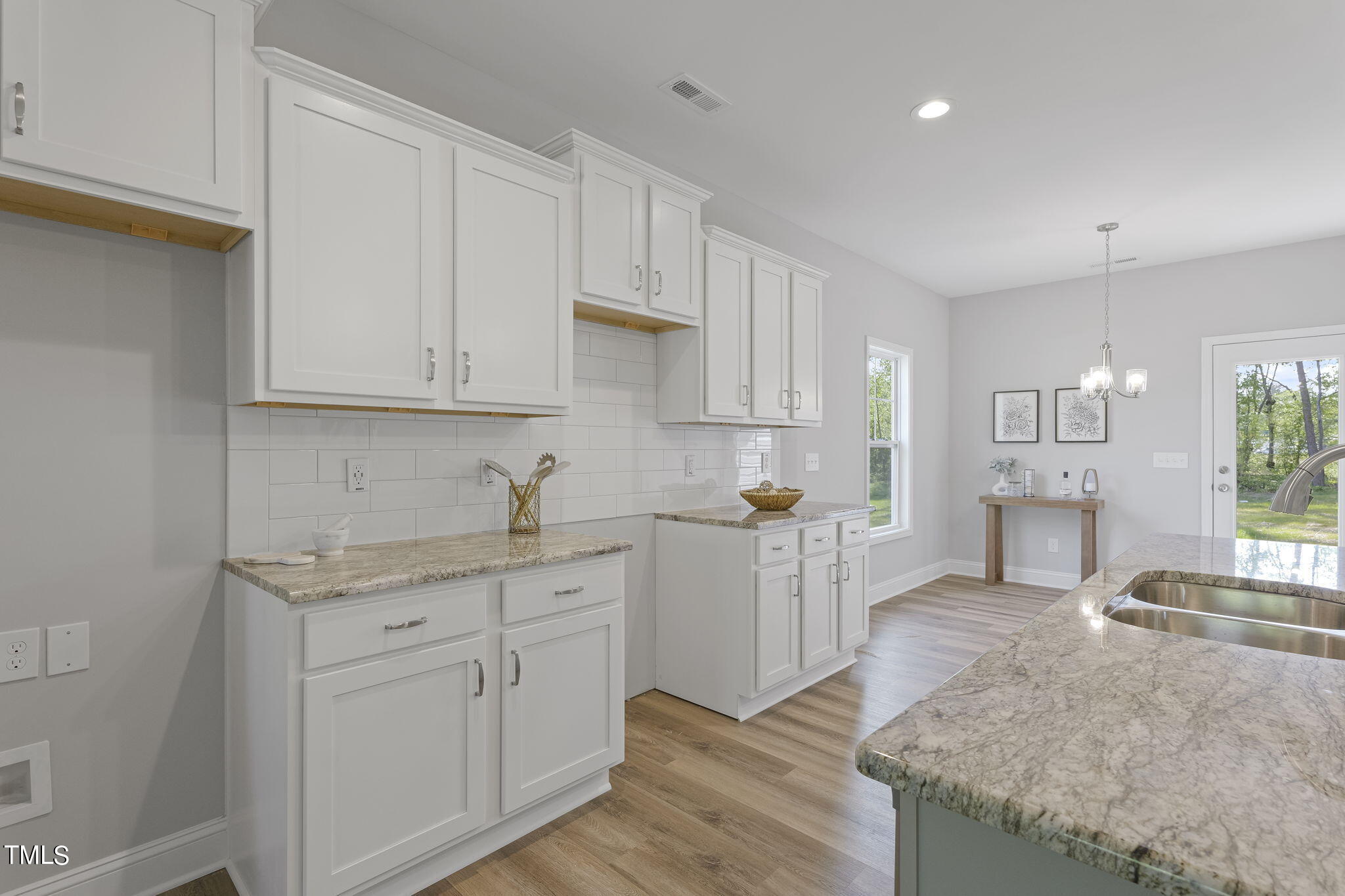 93 Regis Lane Coats, NC 27521 - Photo 11 of 31 a kitchen with white cabinets and sink