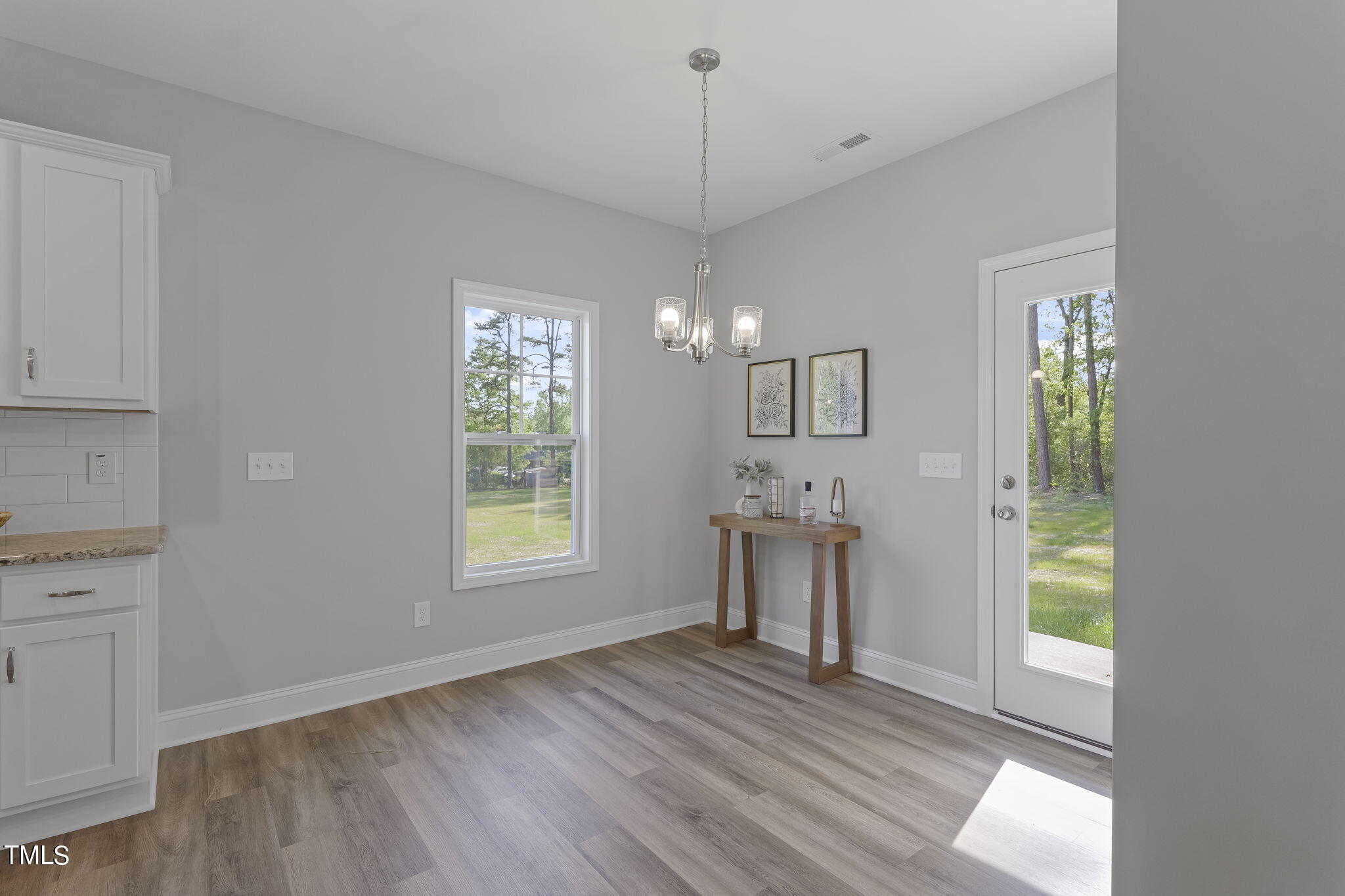93 Regis Lane Coats, NC 27521 - Photo 14 of 31 a view of a room with window and wooden floor