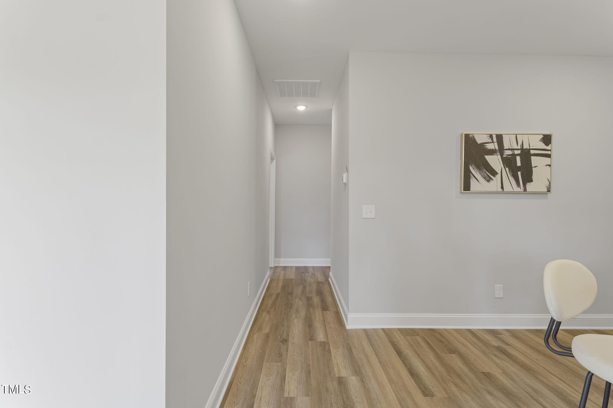 93 Regis Lane Coats, NC 27521 - Photo 16 of 31 a view of a room with wooden floor and lounge chair
