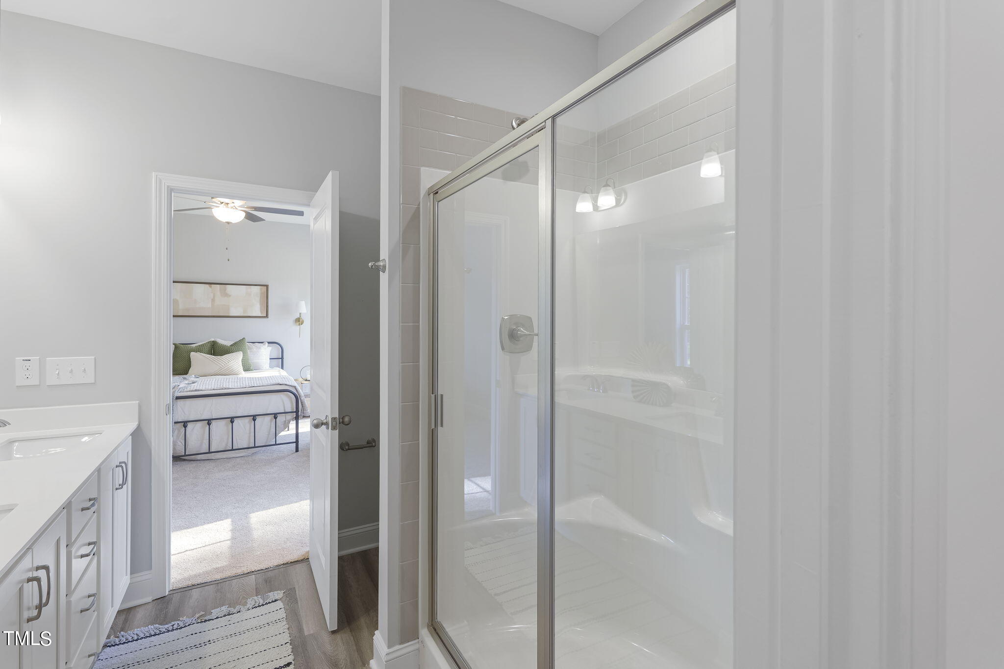 93 Regis Lane Coats, NC 27521 - Photo 19 of 31 a bathroom with a glass shower door