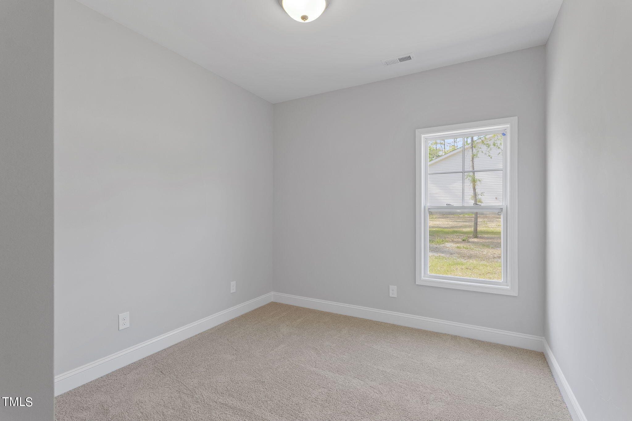 93 Regis Lane Coats, NC 27521 - Photo 20 of 31 an empty room with a window