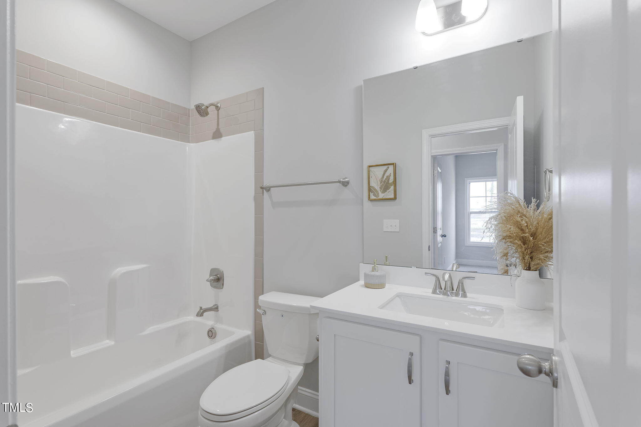 93 Regis Lane Coats, NC 27521 - Photo 22 of 31 a bathroom with a sink toilet and shower