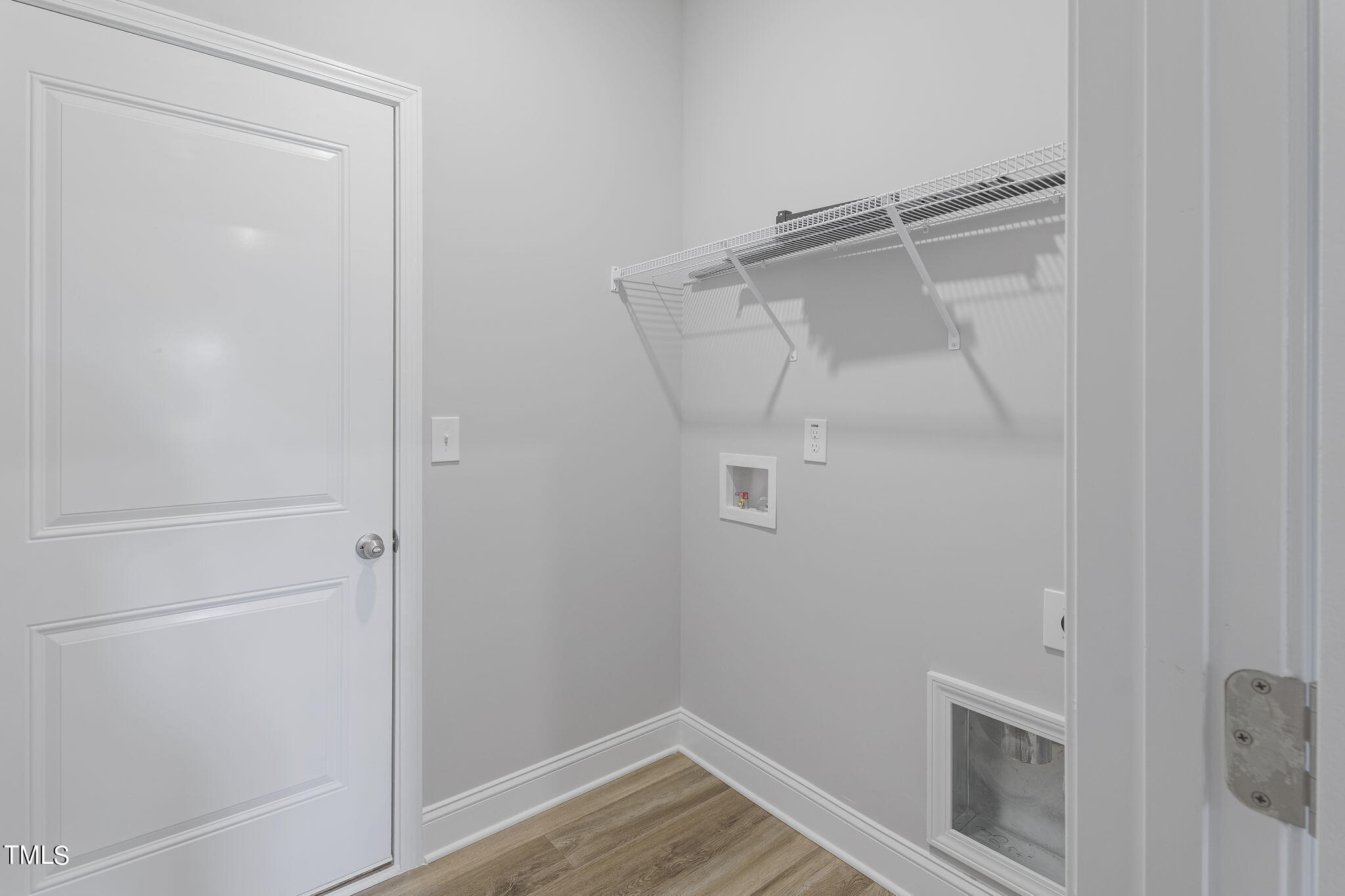 93 Regis Lane Coats, NC 27521 - Photo 23 of 31 a view of storage and utility room with a wooden floor