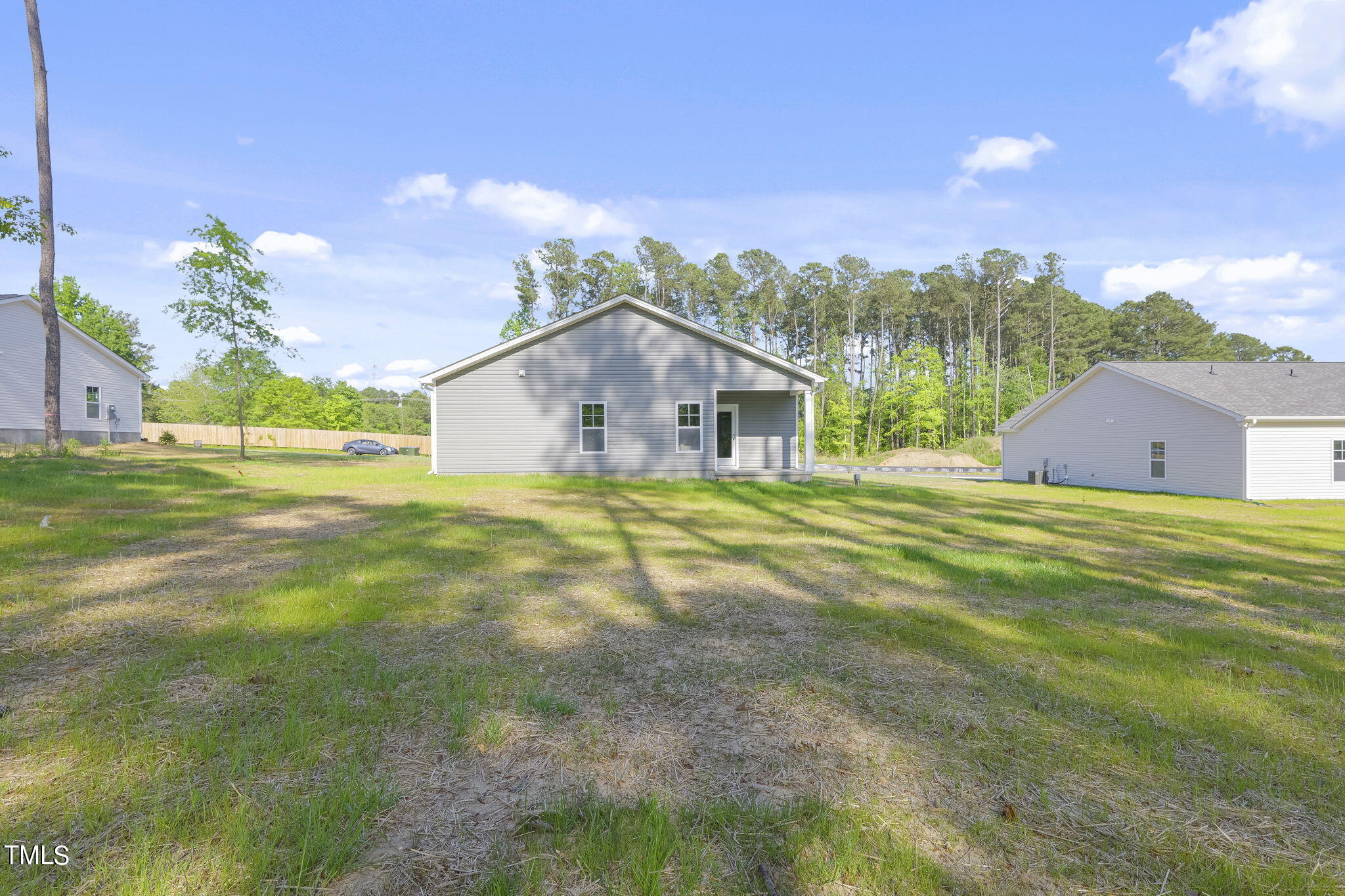 93 Regis Lane Coats, NC 27521 - Photo 24 of 31 a house view with a big yard